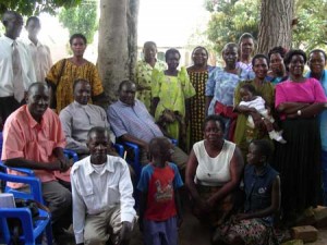 FLP Trainer Ruth (kneeling in white top) with facilitators and clergy at Lowero, Uganda